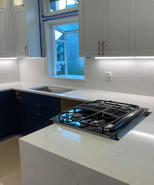 Countertops with full high backsplashes and one waterfall leg in Mukilteo 